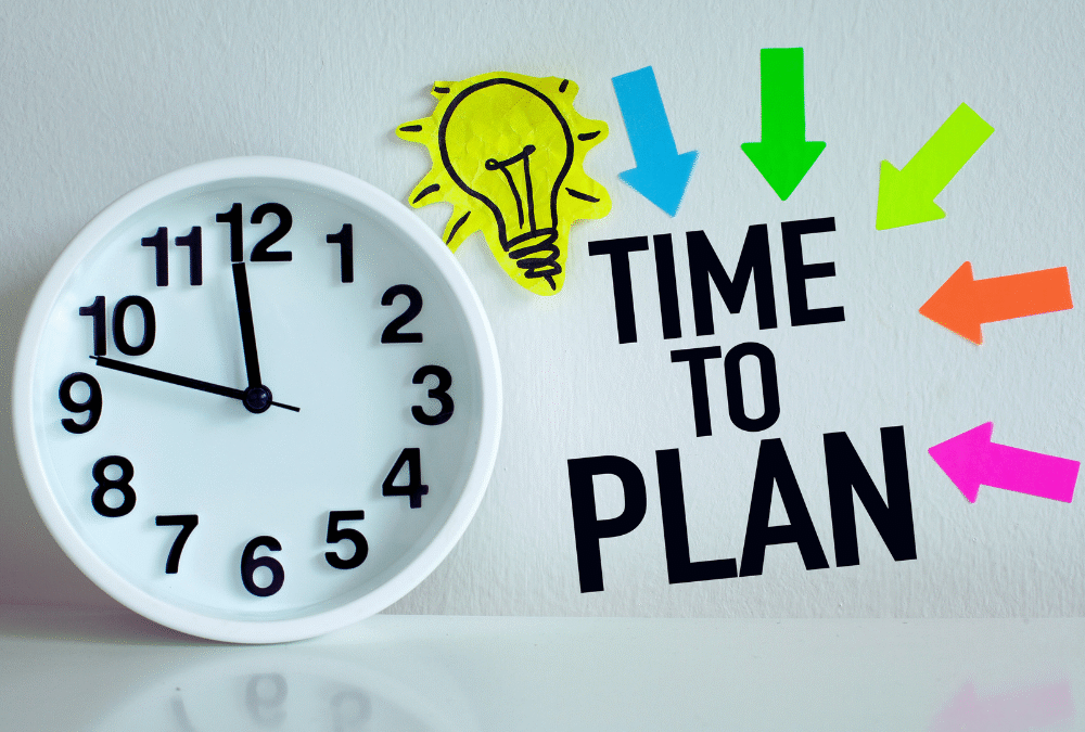 Clock with clock hands showing 11:48. The photo has graphics overlaying the photo that say "time to plan" with a lightbulb floating.